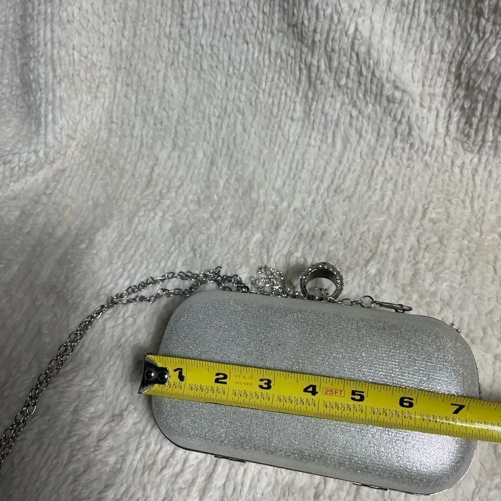 Elegant Silver Clutch with Rhinestone tassels Detailing.